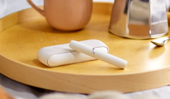 IQOS 3 next to coffee cups
