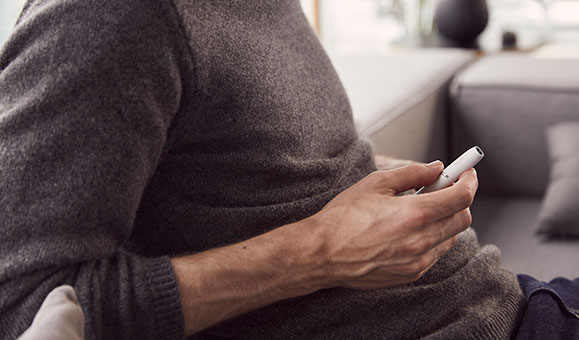 Man Holding IQOS 3 White