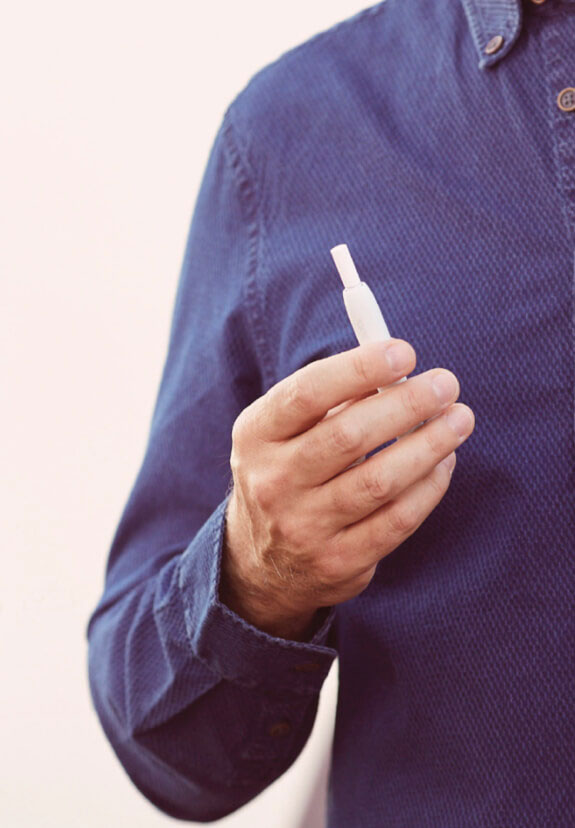 Man Holding IQOS 3 White with Heets
