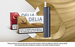 IQOS ILUMA i ONE device displayed with DELIA Classic Gold and DELIA Classic Red on a gold-toned background with abstract graphic elements.