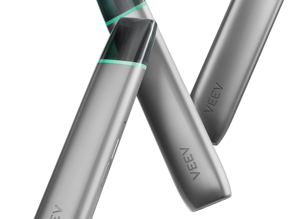 Three VEEV ONE electronic cigarettes on close up.