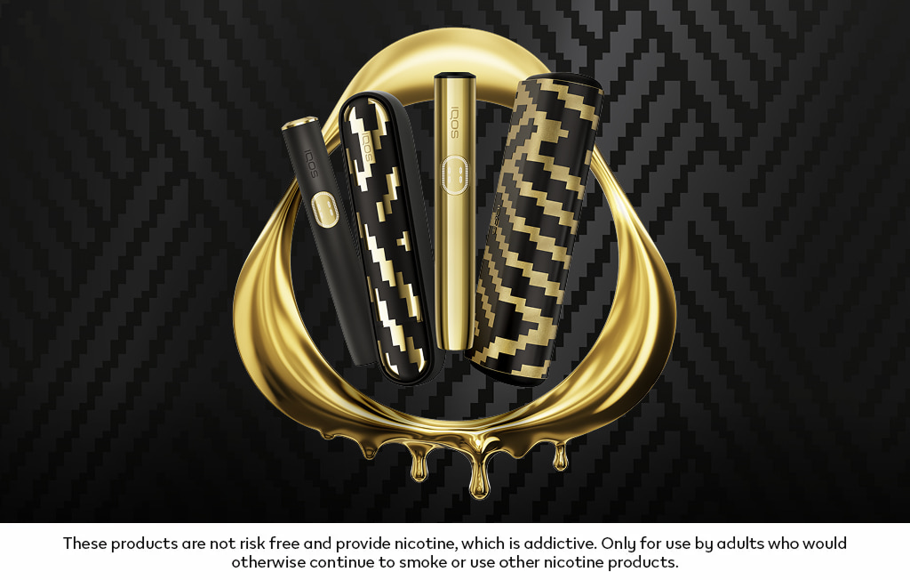 IQOS ILUMA i x Seletti and IQOS ILUMA i PRIME x Seletti Limited Edition devices in a golden IQOS logo.