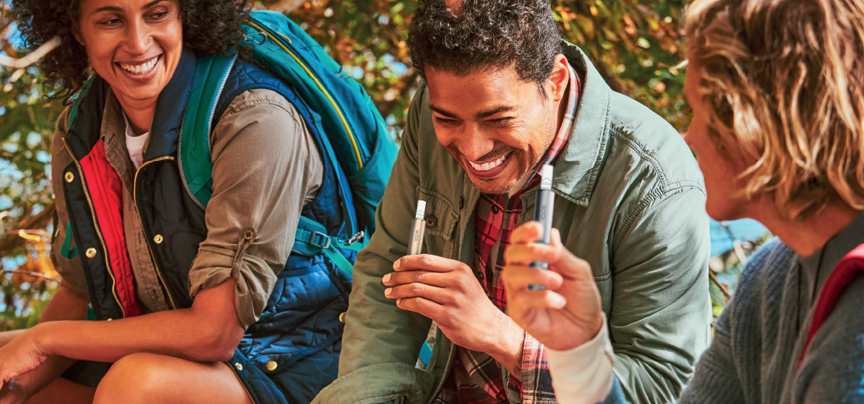 group of people with IQOS ILUMA devices