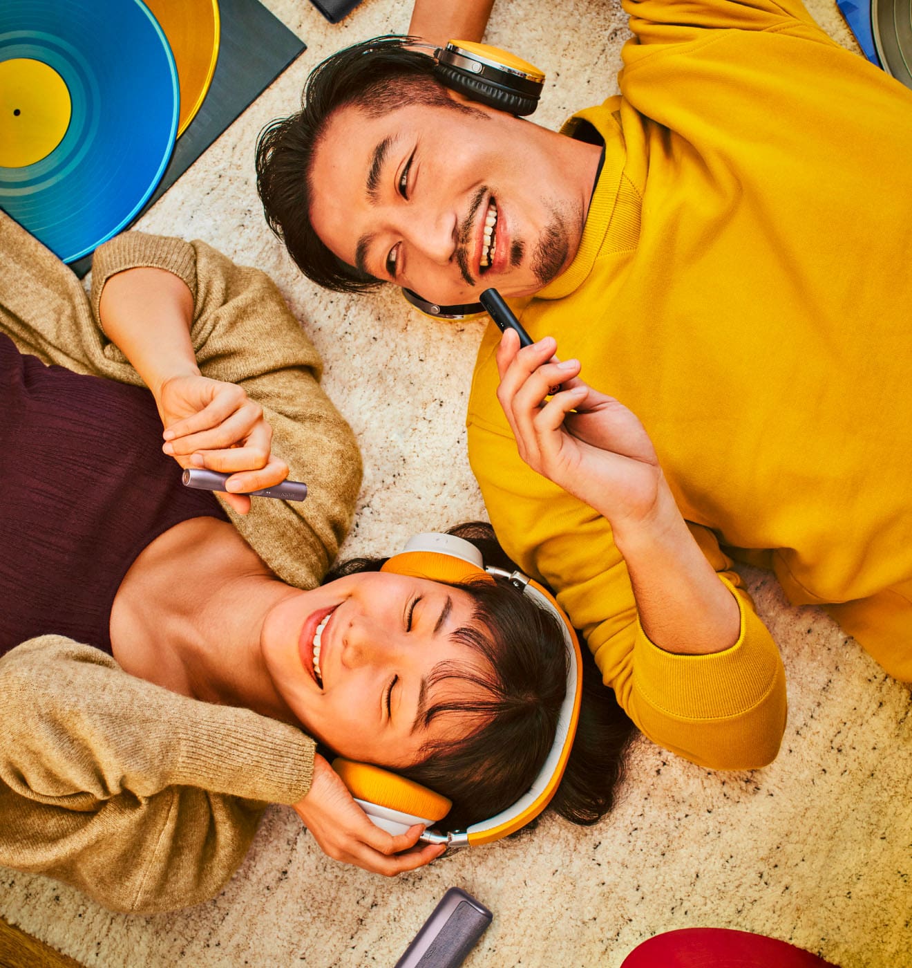 A group of people listening to music and using IQOS ILUMA