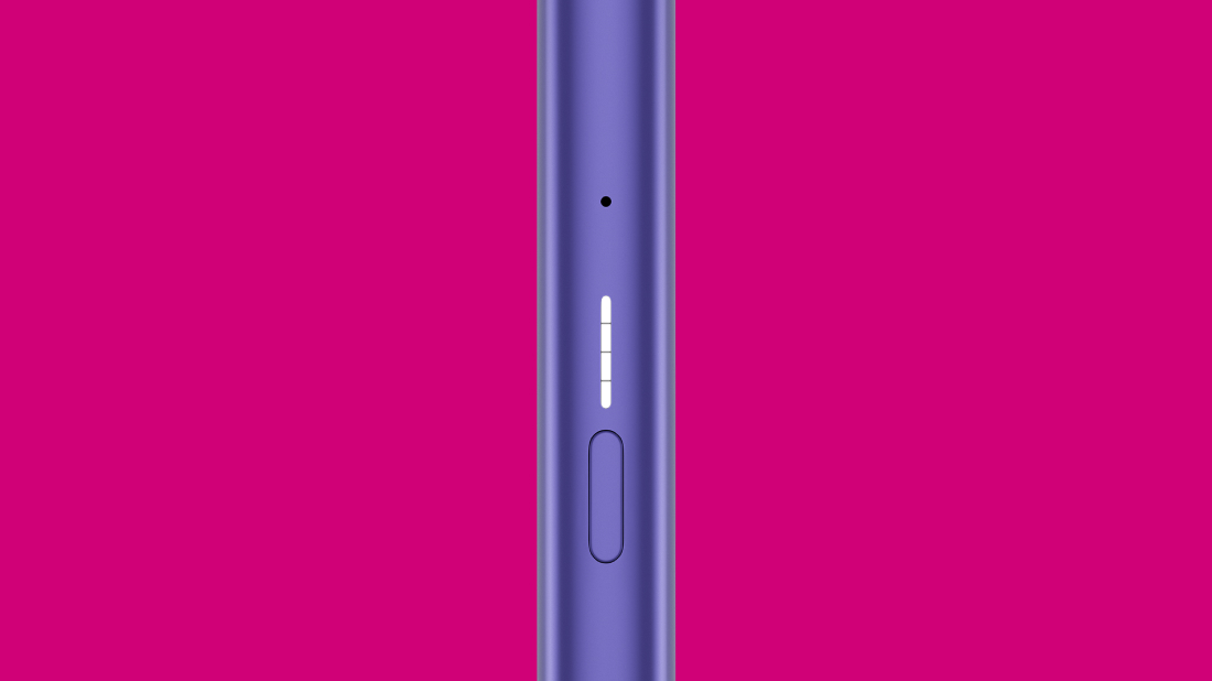 VEEV ONE device on a pink background