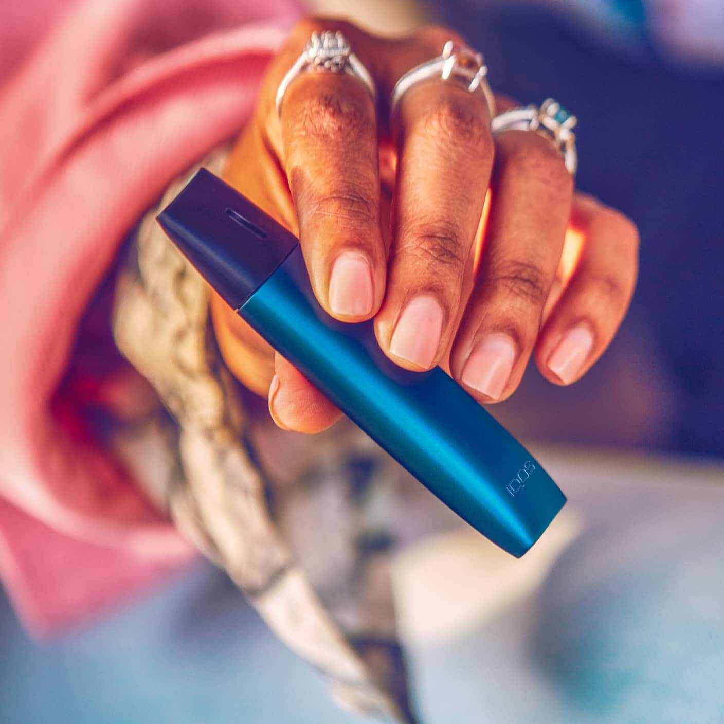 IQOS VEEV e-cigarette device in Marine Blue color.