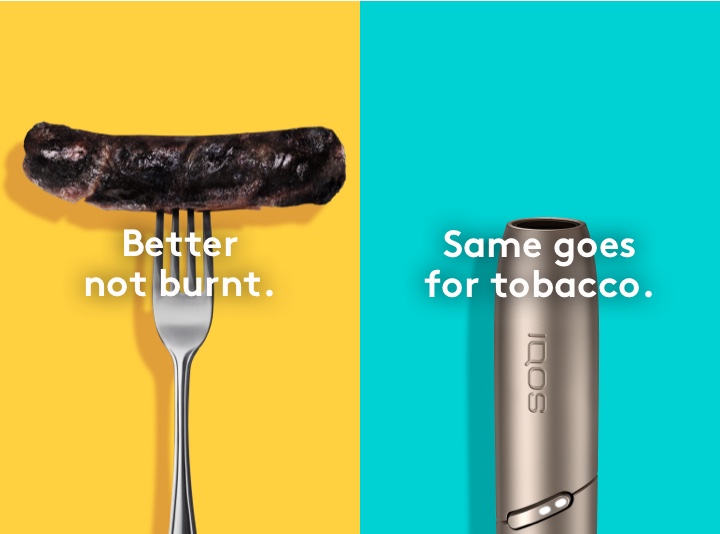 Burnt sausage on a fork compared to clean IQOS HEETS stick in IQOS 3 DUO holder