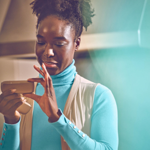 Girl looking at her IQOS device