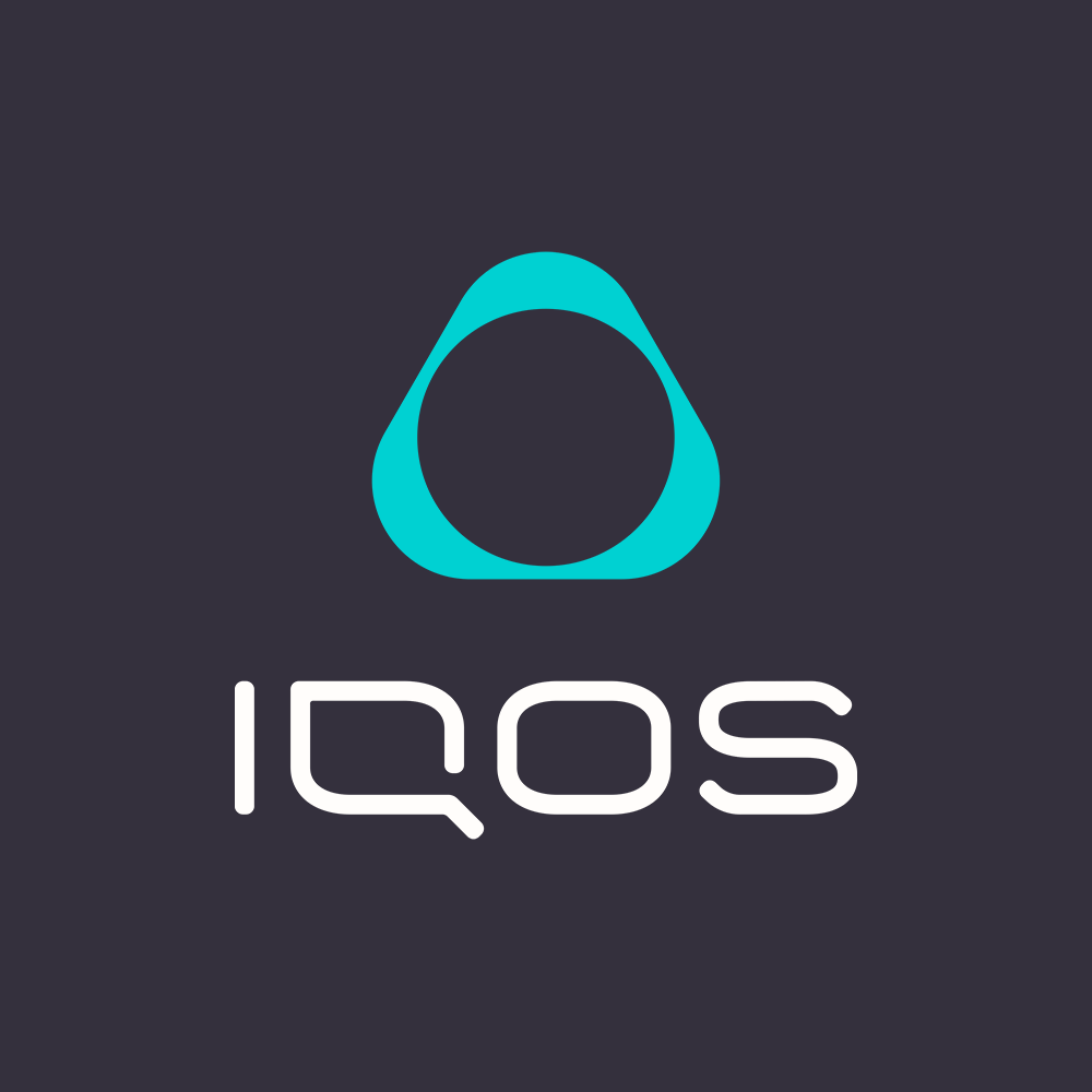 woman looking outside of a car window holding an IQOS 3 DUO