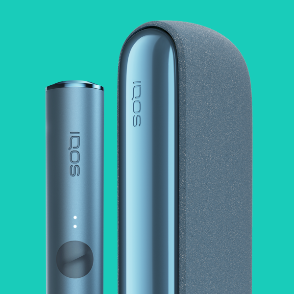 A bright IQOS ILUMA Pocket Charger and Holder in a person's hand.