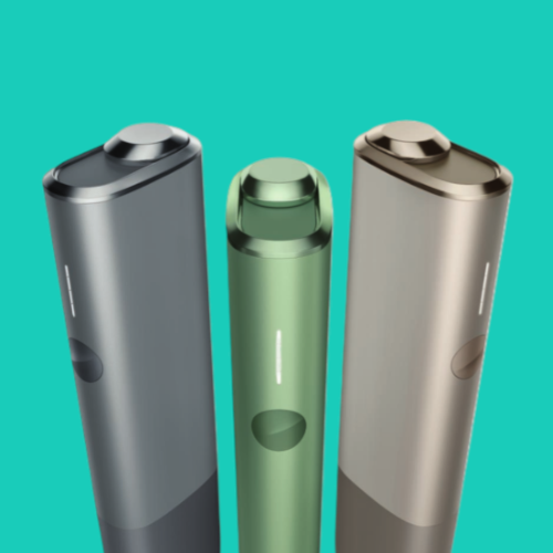 A person inserts a TEREA stick into an IQOS ILUMA ONE.