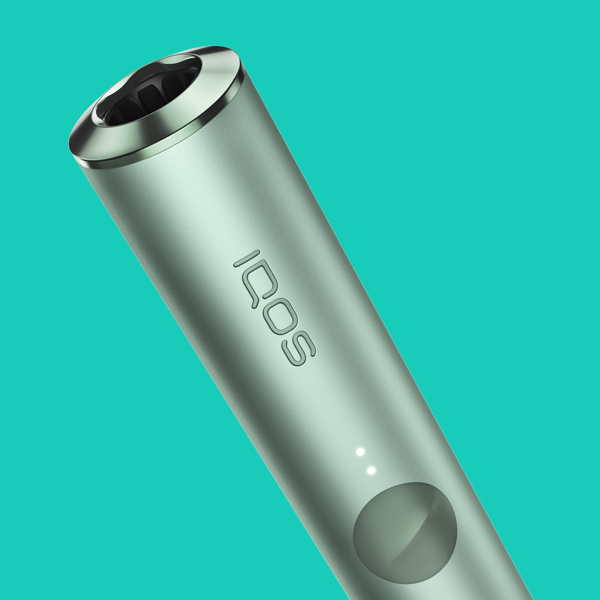 A Jade Green IQOS ILUMA PRIME Pocket Charger. 